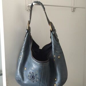Blue leather coach purse.